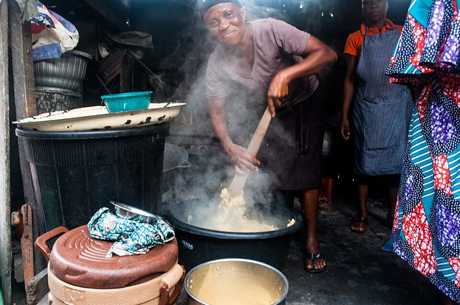 Cook stirring pots in a busy buka kitchen